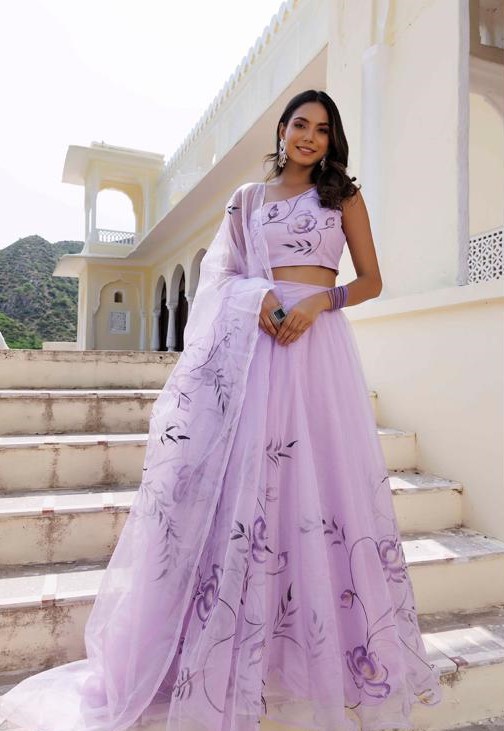 Lavender floral print lehenga with sleeveless blouse and matching dupatta, perfect for summer weddings and festive celebrations.